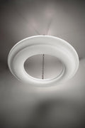 White circular chandelier with a textured surface, hanging from a chain.