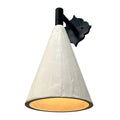 White conical wall sconce with a decorative black backplate, casting warm light.