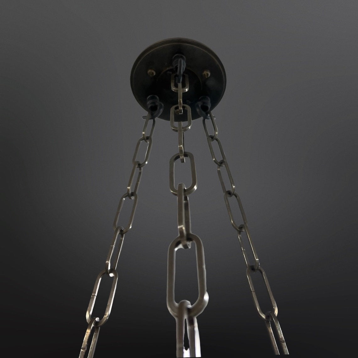 Close up of a small Fluted Pendant Plaster Chandelier dark metal chains.