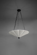 The Small Fluted Pendant Plaster Chandelier, featuring a white, fan-like or fluted plaster shade, suspended by dark metal chains from a matching ceiling mount.